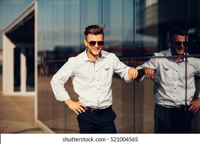 High Fashion Look.Young Stylish Confident Happy Handsome Businessman Model In The Street In Sunglasses