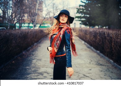 High Fashion Portrait Of Elegant Woman In Black Hat And In A Red Scarf 