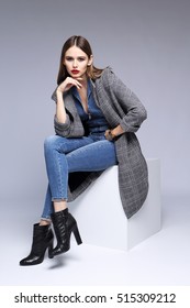 High Fashion Portrait Of Young Elegant Woman. Grey , Skinny Denim Overall, Black Ankle Boots