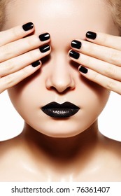 High fashion style, manicure, cosmetics and make-up. Dark lips makeup & nails polish. Close-up portrait of female model with black lipstick, fingernails and gloss skin