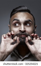 High Fashion Style Portrait Of A Man Splitting His Beard, Esquire Style