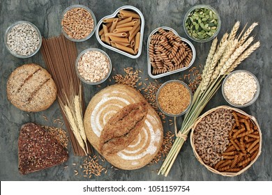 High fibre health food concept with multi seed whole grain bread loaf and seeded rolls, whole wheat pasta, grain, seeds and cereals. Food high in omega 3 fatty acids, antioxidants, protein & vitamins. - Powered by Shutterstock