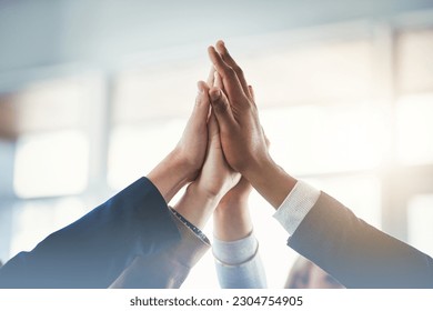 High five, businesspeople and their hands together for cooperation with lens flare. Collaboration or teamwork, group or coworkers support and people with hand in air for unity or achievement - Shutterstock ID 2304754905