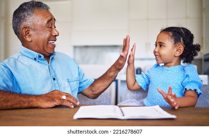 High Five, Child Learning And Black Family Grandfather Support, Helping Or Care For Home Education Or Language Development Motivation. Elderly Man Teaching Girl Kid And Goal Target Success Hand Sign