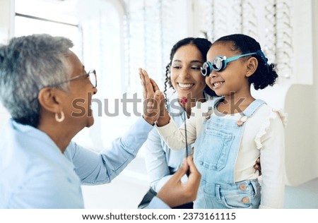 High five, children and a family with a happy optometrist in a clinic for an eye exam to test for prescription frame lenses. Support, motivation or trust with a girl and her parent at the optician