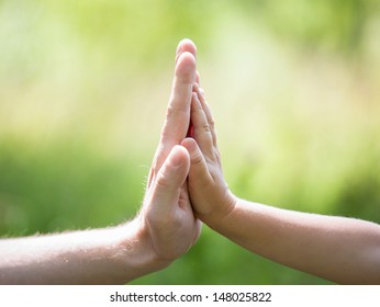 High Five Gesture Of Father And Child