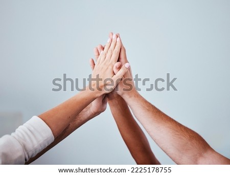 High five, team and hands of people in celebration for teamwork achievement, team building meeting or collaboration. Group solidarity, support and community friends celebrate charity mission success