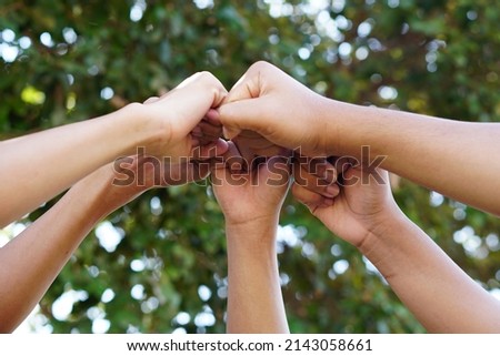 High five team work as a team together, air hands bless the power tag team. Multi-ethnic groups Unity together in the volunteer community. Cooperation Business team success concept.