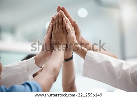 High five, teamwork and doctors hands in collaboration for mission, goal or team building together. Mindset, target or medical group with trust, motivation or support for vision, winning or success.