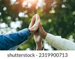 High five teamwork is a team together. unity concept Conservation of nature, the environment, groups of people of various nationalities business team success concept together
