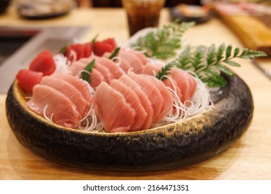 High Grade Fatty Tuna Fillet On Wooden Table In Japanese Restaurant. Raw Fish Meat. Otaro Or Sesami.