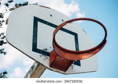 high hanging basketball hoop and clouds