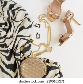 High Heel Shoes ,hand Bag,cloth And Accessories Top View On White Background.Women's Summer Glam Outfit.