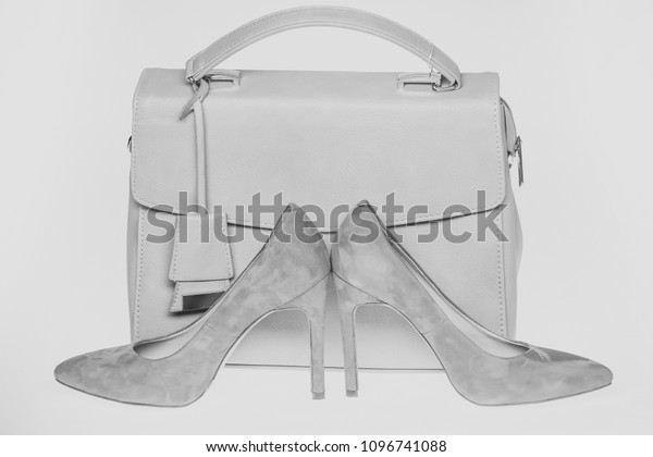 white heels and bag