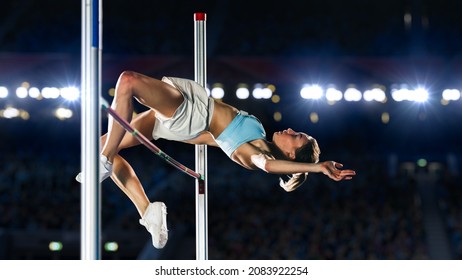 High Jump Championship: Professional Female Athlete On World Championship Successfully Jumping Over Bar. Shot Of Competition On Stadium With Sports Achievement Experience. Determination Of Champion.