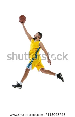 High jump. Dynamic portrait of professional basketball player jumping with ball isolated on white studio background. Sport, competition, hobby, active lifestyle. Motion, activity, movement concepts.