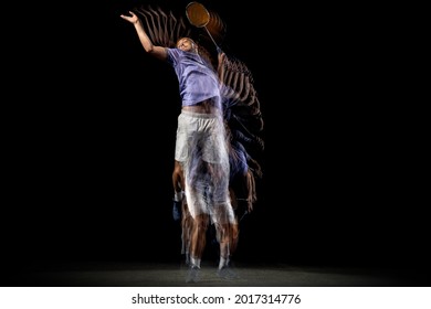 High jump. One young male badminton player, shuttler training on dark background. Stroboscope effect. Concept of healthy lifestyle, professional sport, action, motion, hobby, team.