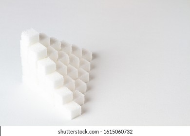 High Key Closeup Of A Pyramid Of Sugar Cubes Arranged In A Cube Pattern