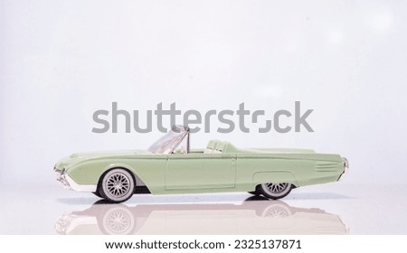 High key photograph of a 1961 Ford Thunderbird Cabriolet toy model car