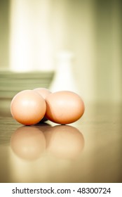 High Key Photograph Of Three Eggs On A Counter-top In The Kitchen. Very Shallow Depth Of Field. Lots Of Space For Text Or Other Items.