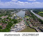 high level aerial view of the lock gates and entrance to the inner basin of the re-developed docks area and new marina in Preston, Lancashire, England 