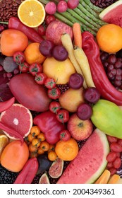 High in lycopene fresh fruit and vegetable collection for good health with immune boosting superfoods also high in anthocyanins antioxidants, dietary fibre, vitamins. Healthy eating concept. Flat lay.