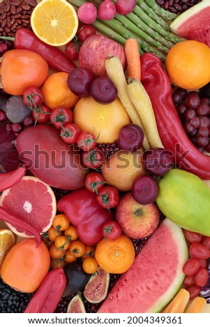 High in lycopene fresh fruit and vegetable collection for good health with immune boosting superfoods also high in anthocyanins antioxidants, dietary fibre, vitamins. Healthy eating concept. Flat lay.
