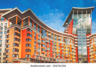 High Modern Apartment Building Under Blue Sky.