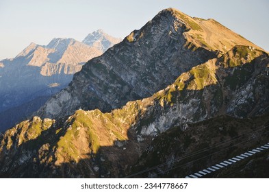 High mountains in the rays of the setting sun
