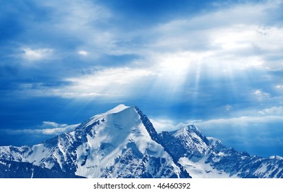 high mountains under a rays of sun