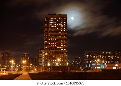 High Multi-storey Residential Building Illuminated On A Moonlit Night.