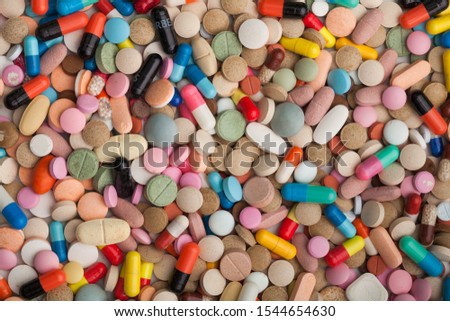 High number of colorful pills, stack colorful