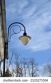 High Outdoor Chandelier By The Building Wall