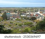 High overview of the Victorian-era Ferndale Cemetery and beyond the historic town of Ferndale, California.