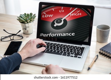 High Performance Concept. Man Working With A Computer, Performance Gauge Speedometer On The Screen, Office Background.