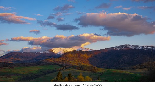 High perspective view of the mountains during sunset. Some mountain peaks. The concept of landscape and nature.