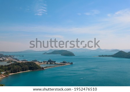 High point view for looking at the location of Sattahip Naval Base with clear sky and blue sea. Sea view and the island close to Sattahip Naval Base, Thailand.