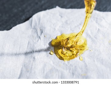 High Potency Dab Wax On Non-stick Paper - Concentrated THC Cannabinoids Extracted From Marijuana Plant