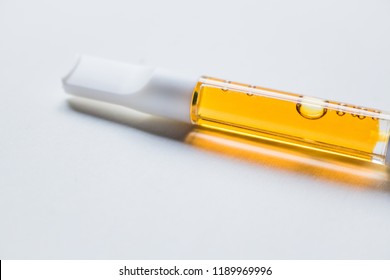 High potency THC oil filled vape cartridge against white background
