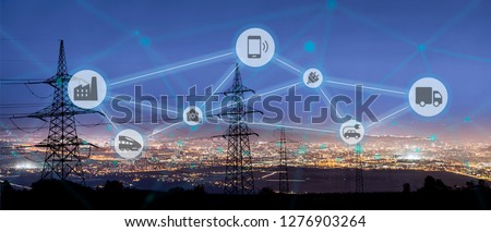 High power electricity poles connected to smart grid. Energy supply, distribution of energy, transmitting energy, energy transmission, high voltage supply concept photo, smart grid, smart home