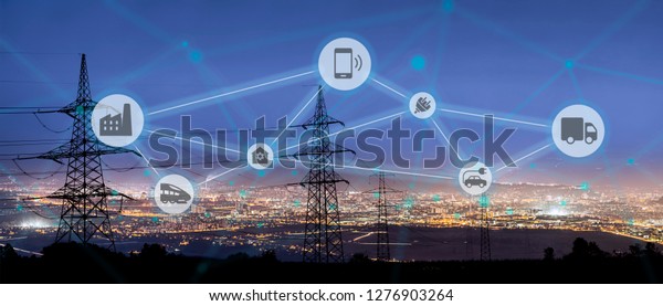 High power electricity poles connected to smart
grid. Energy supply, distribution of energy, transmitting energy,
energy transmission, high voltage supply concept photo, smart grid,
smart home