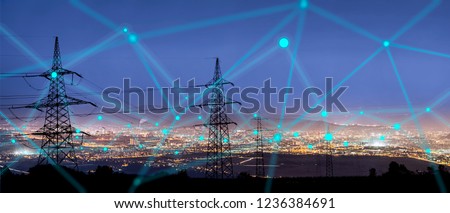 High power electricity poles in urban area connected to smart grid. Energy supply, distribution of energy, transmitting energy, energy transmission, high voltage supply concept photo. 
