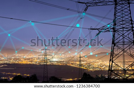 High power electricity poles in urban area connected to smart grid. Energy supply, distribution of energy, transmitting energy, energy transmission, high voltage supply concept photo. 