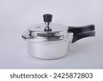 High pressure aluminum cooking pot with safety cover an image isolated, Pressure cooker