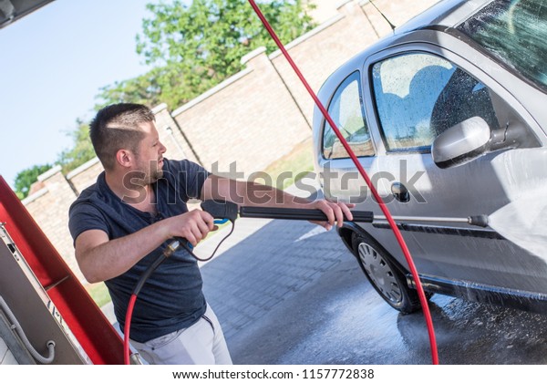 High pressure cleaning the car\
