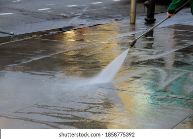 High Pressure Cleaning Driveway Water Splashing The Asphalt Washes The Pavement