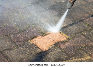 High Pressure Deep Worker Cleaning Driveway With Washer Professional Services