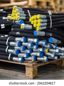 High pressure hydraulic hoses on a pallet. Packaged high pressure hydraulic hoses and ready for transport. Warehouse with hydraulic hoses