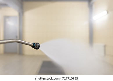 high pressure water jet on the background of the washing box for contact cleaning - Shutterstock ID 717710935