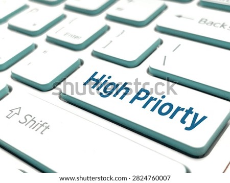 High priority key on computer keyboard representing urgent tasks, focus, importance, and business task management.